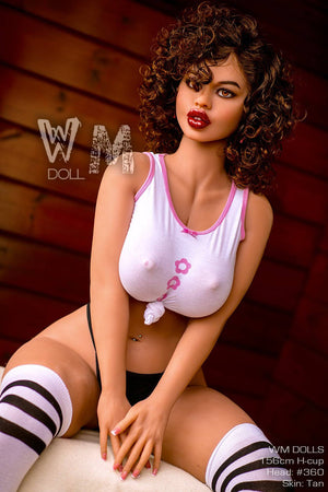 Sex doll with white top and black and white striped stockings against a wooden background