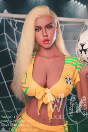 Sex doll in a yellow sports jersey with a soccer ball in the background